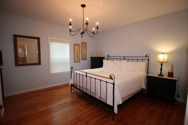 A spacious master suite to make you feel right at home with a TV to enjoy late night movies.