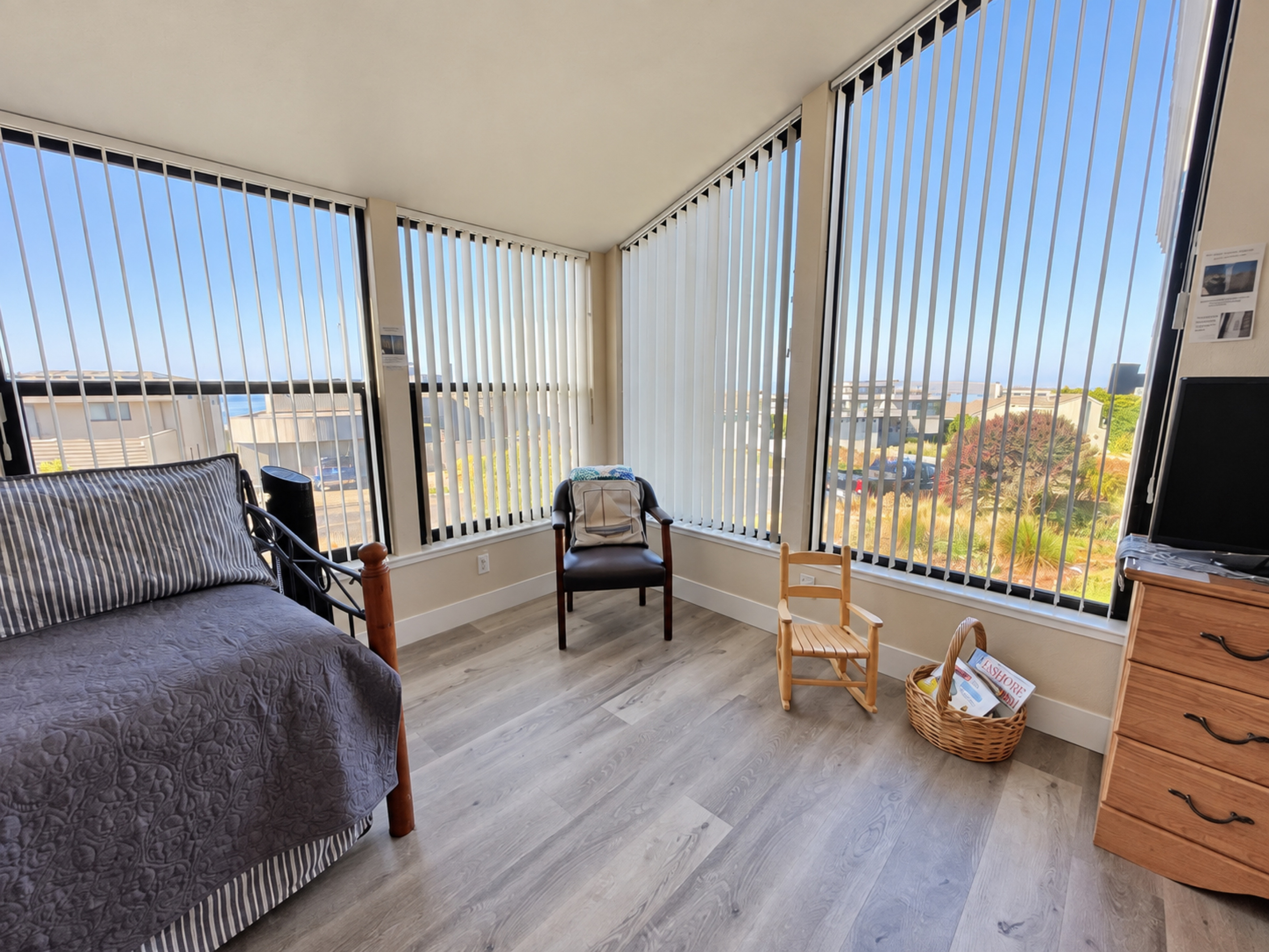 Master Suite large picture windows; child rocker & picture books