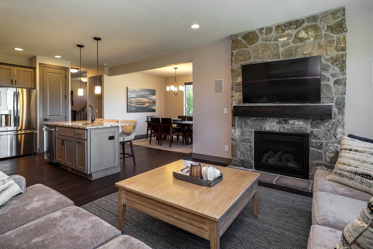 Open-concept living area with fireplace and comfortable seating
