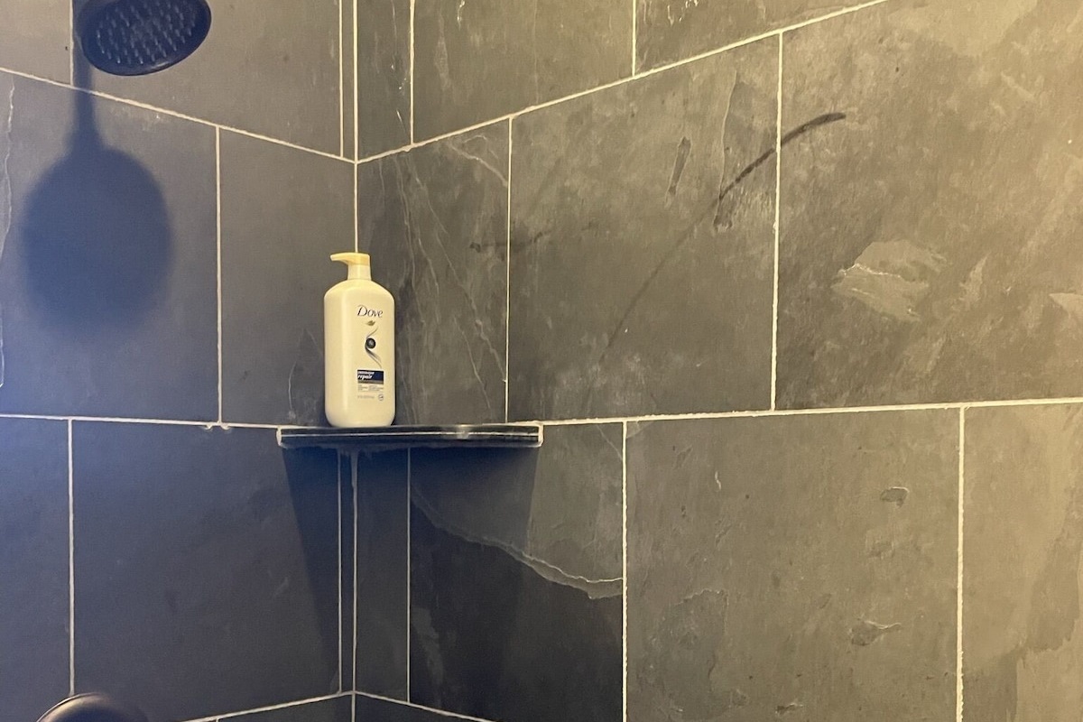 Downstairs full bathroom with custom walk in shower.