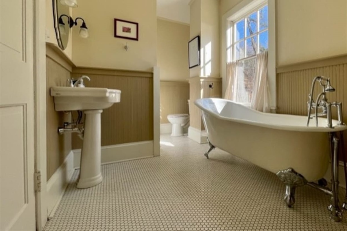 Upstairs Bathroom one...there is a shower on the other side of the wall from the sink