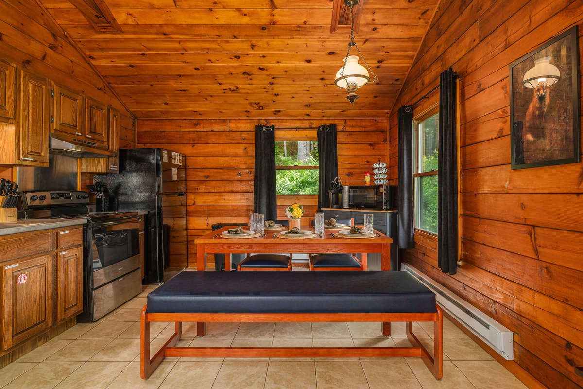 Open-concept kitchen and dining area with full appliances and seating for up to five—perfect for meals or game night.