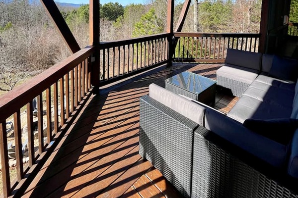 Mountain views from the wrap-around porch, large outdoor couch on the back deck a-frame overlooking the back yard! 
