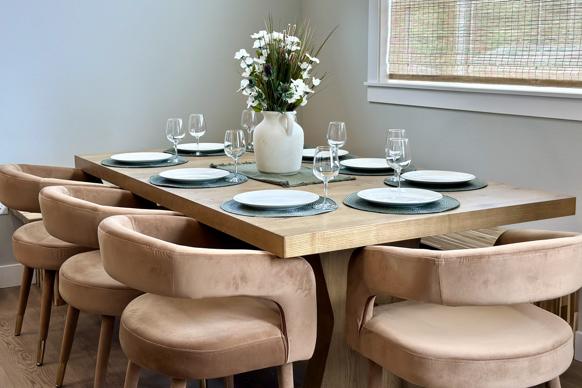 The table's already set — gather everyone for a big dinner in after a day on the sand.