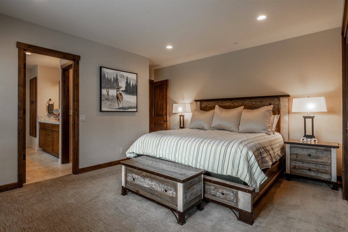 Double Black (MS2) primary suite features a king bed, elevated privacy, and natural alpine light — your quiet retreat after a full day on the mountain.