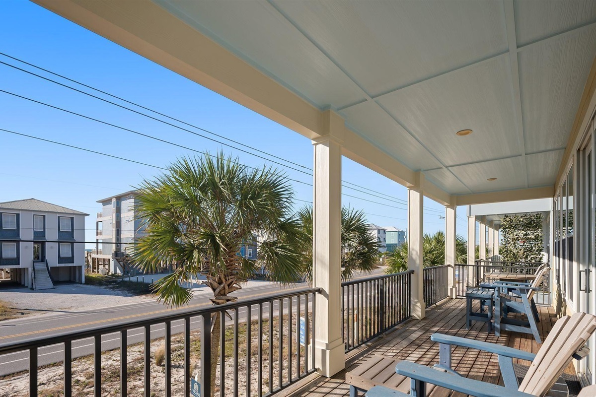 Beautiful covered front porch with Gulf views and plenty of seating 