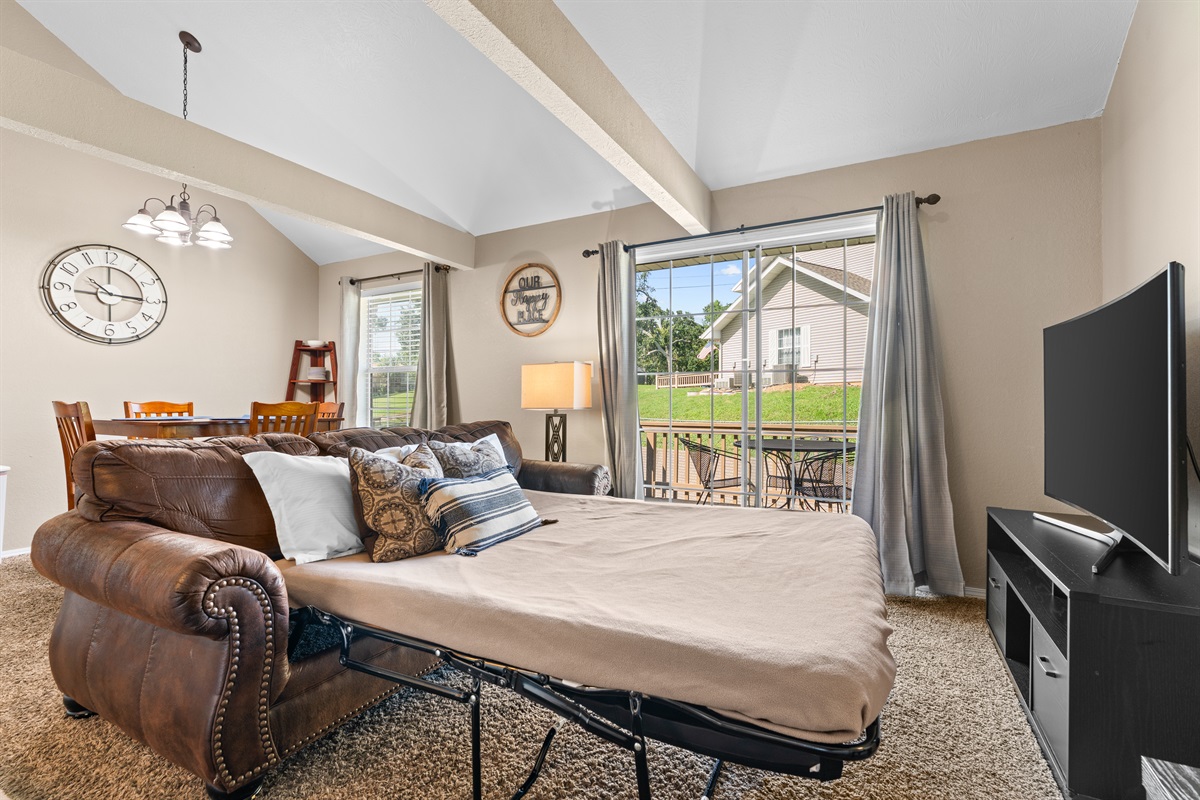 The sleeper sofa adds flexible sleeping space for families or small groups.