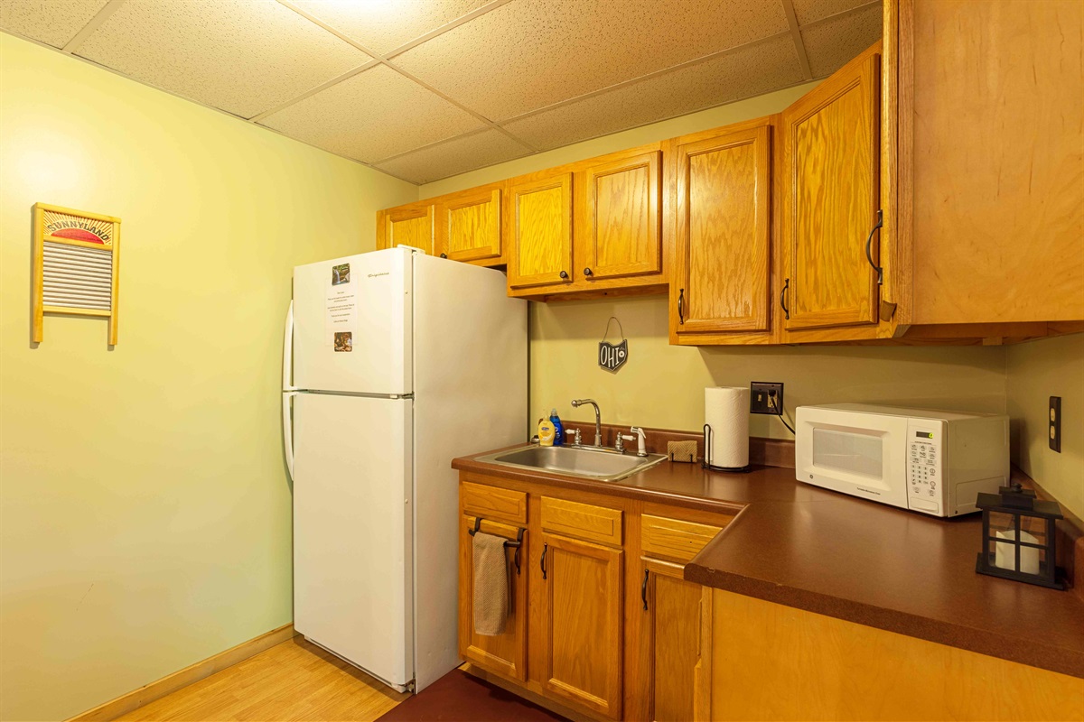 Our lower-level kitchenette is perfect for use for snacks and extra fridge storage.