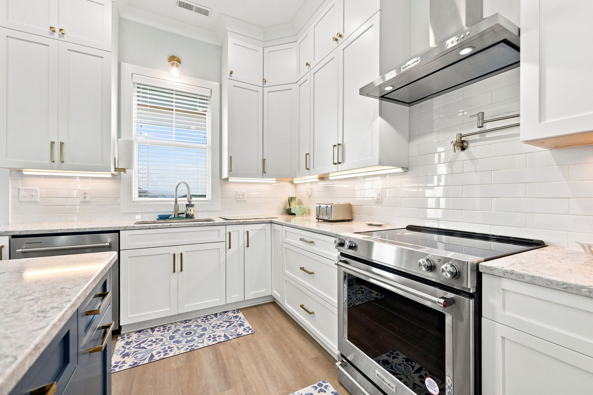 Prepare your favorite vacation meals in a modern, fully equipped kitchen designed for effortless cooking and gathering with family and friends
