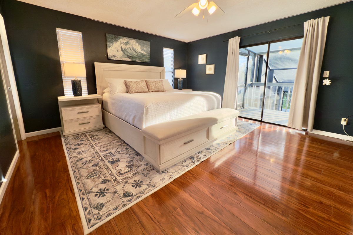 A stylish and serene primary bedroom designed with comfort and class in mind.