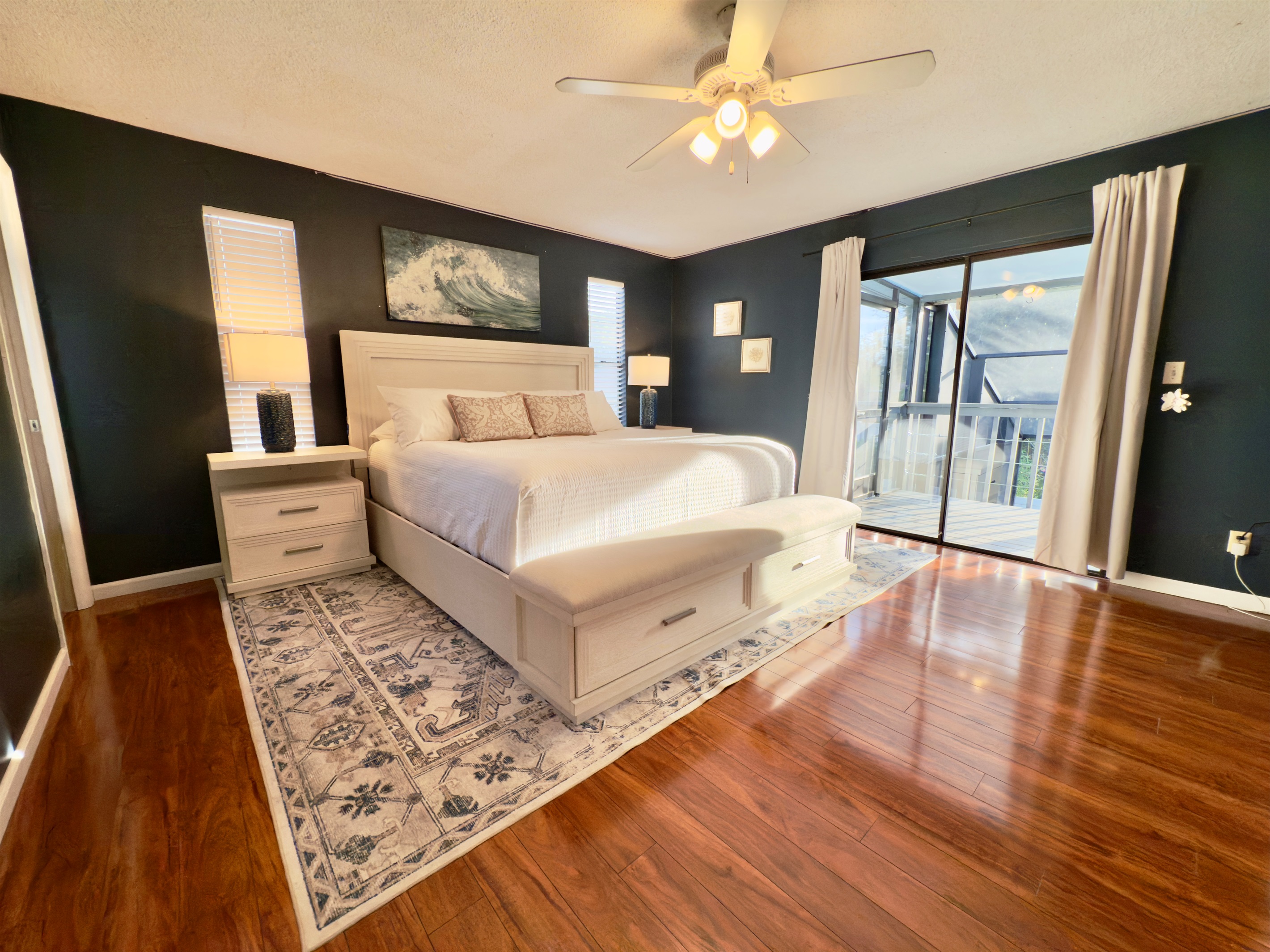 A stylish and serene primary bedroom designed with comfort and class in mind.