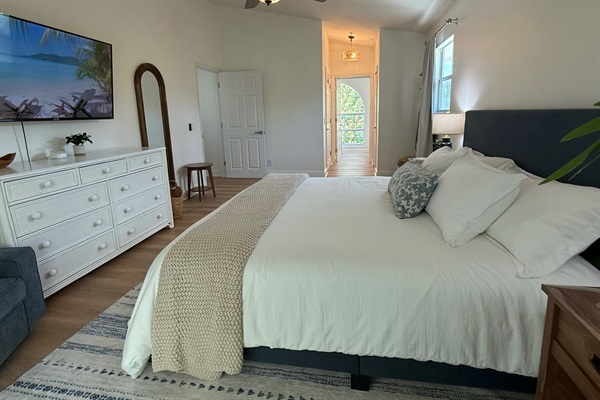Master King Bedroom on the main level with large TV and private balcony
