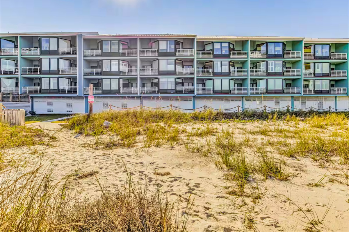 The beachfront condo sits just steps from the sand, offering easy access to the water.