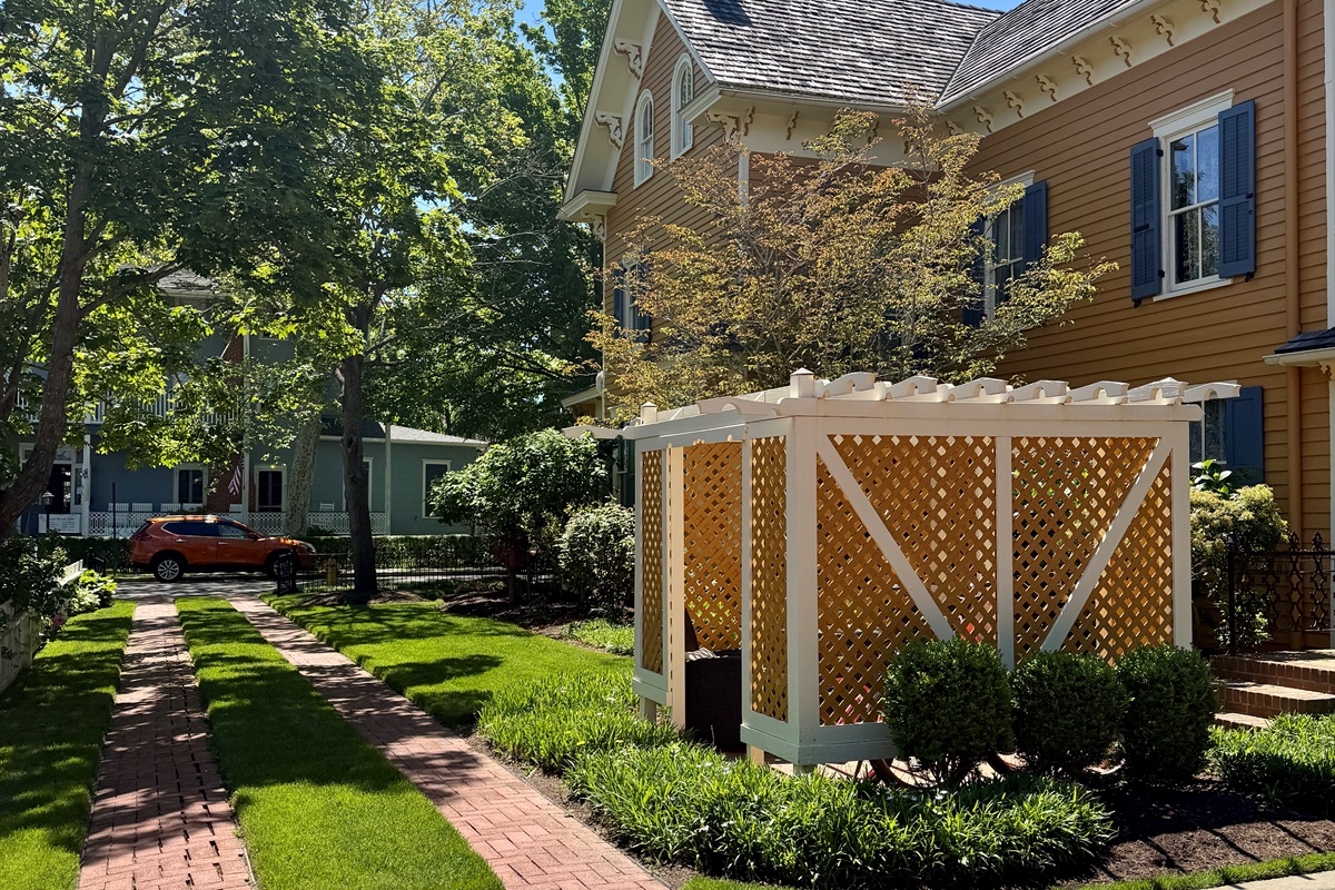 The outdoor space shines at this property offering outdoor dining and shower, and a place to store beach gear and bikes