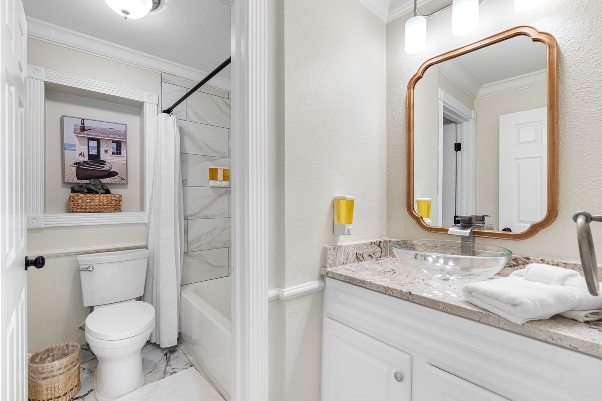 The modern design combines sleek finishes with practical elements, offering a calming and luxurious environment for daily routines.