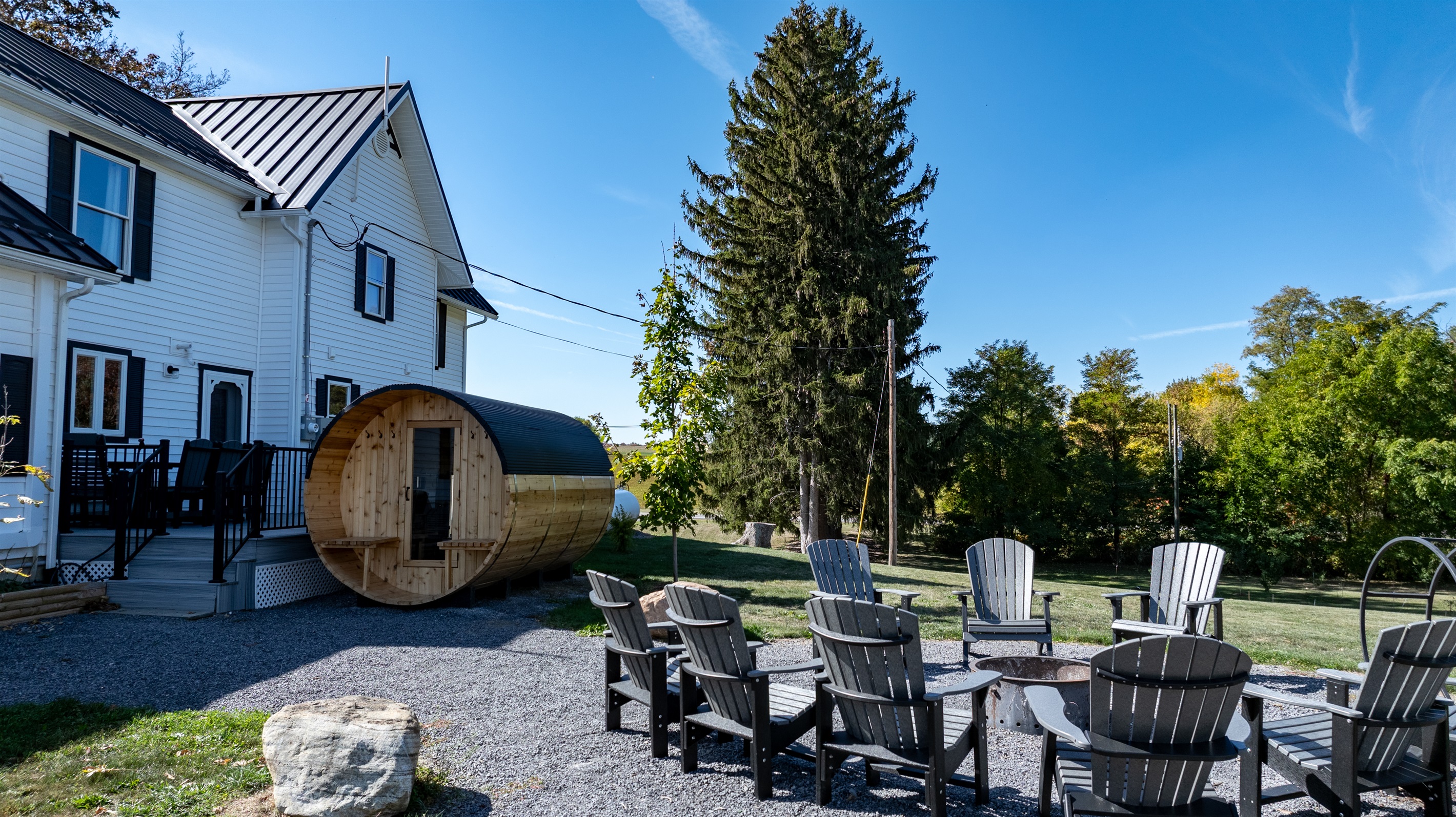 Relax under the stars beside the cozy fire pit or unwind in the private barrel sauna — pure upstate tranquility