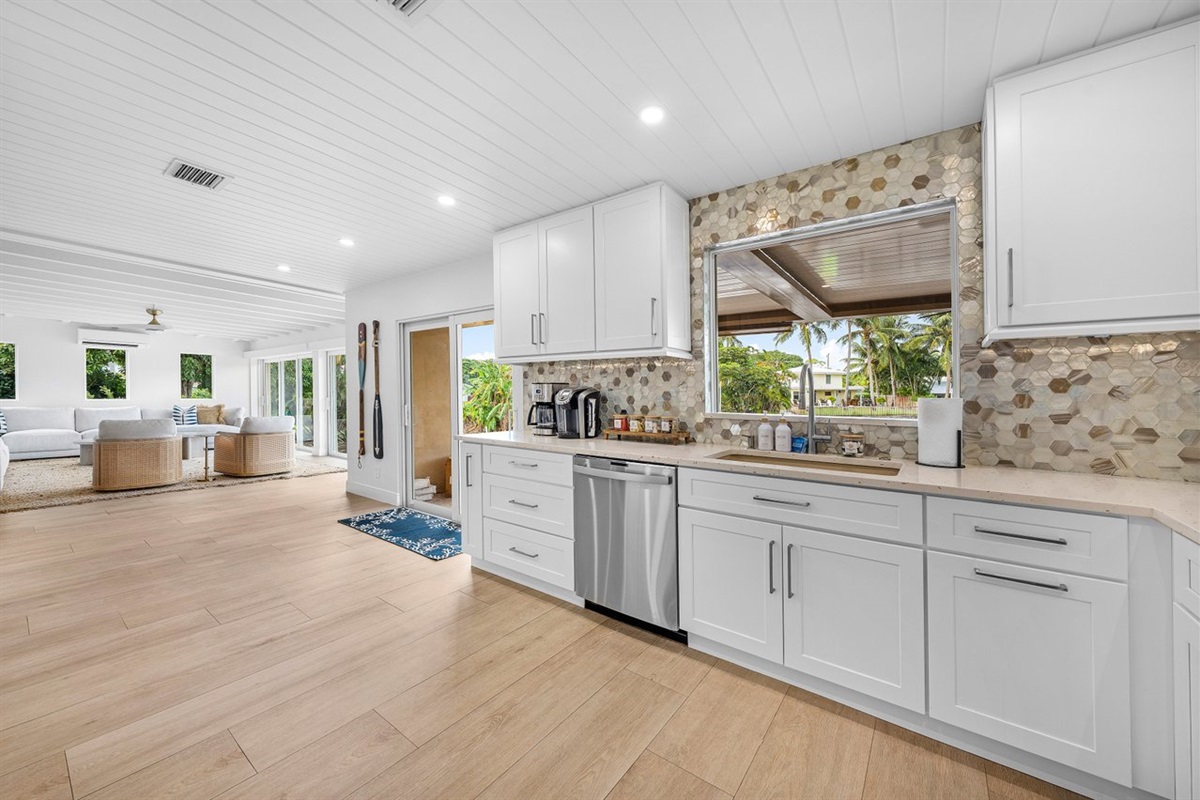 Seamless indoor-outdoor flow with a window overlooking lush greenery