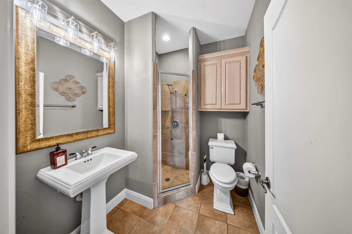 Upstairs bathroom with a standalone walk in shower.
