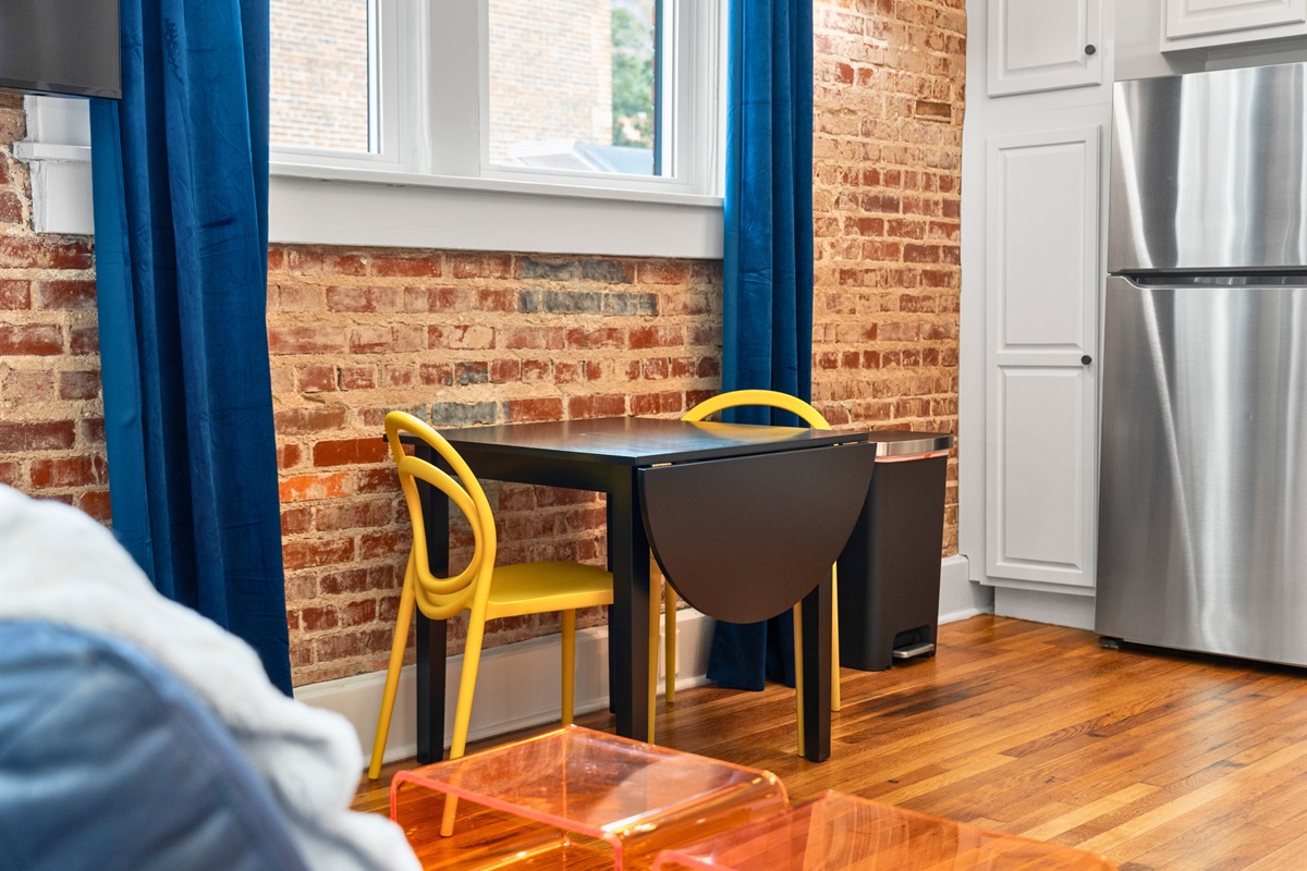 This bright dining nook, with sleek modern chairs and plenty of natural light, is an ideal spot to enjoy meals or sip your morning coffee.