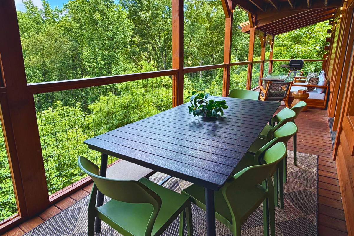 Dine among the treetops on the covered deck, surrounded by the peaceful beauty of the Smoky Mountains.
