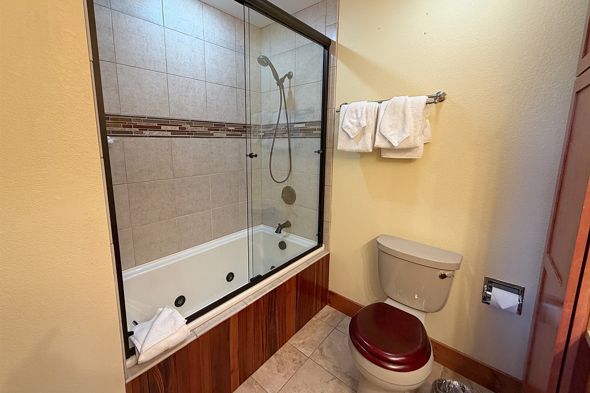 Primary attached full bathroom with dual vanity sinks.