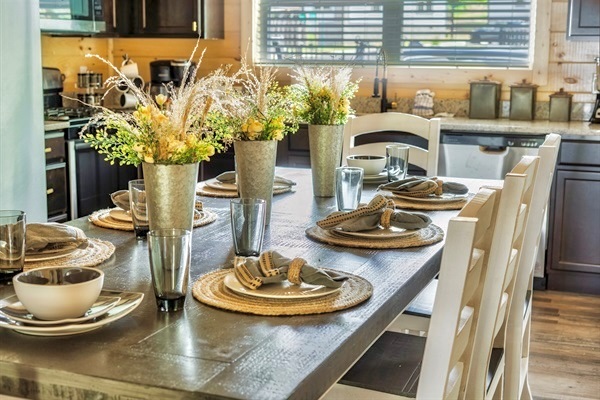 Immerse yourself in the culinary arts in this beautifully adorned kitchen, stocked with a complete array of cooking tools, including a slow cooker and blender, ensuring unforgettable dining experiences