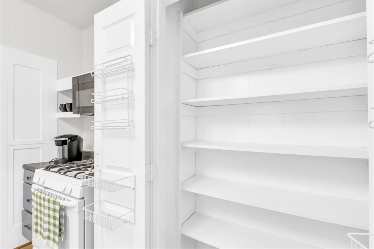 Pantry interior with ample shelf storage.