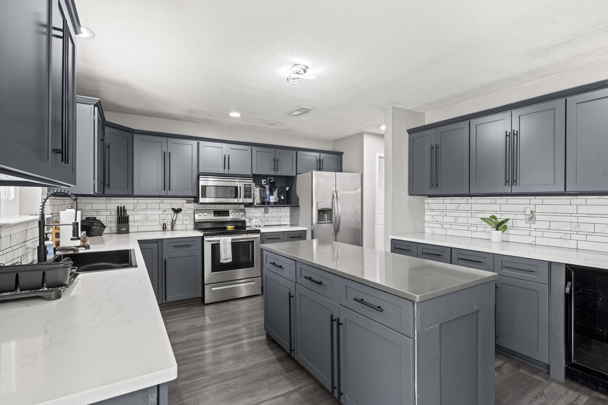Countertops and an oversized island make this kitchen perfect for cooking together or spreading out a big meal.