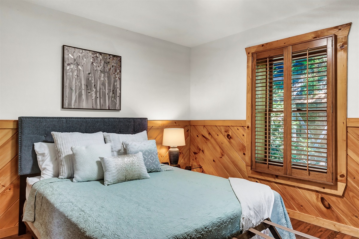 Lower floor with welcoming queen bed.