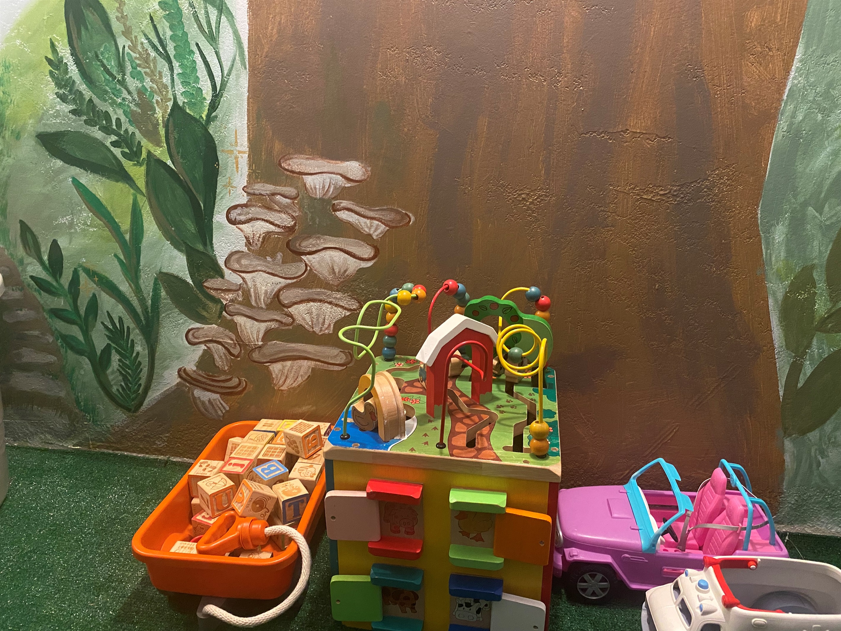 There is a large variety of toys in the playroom for varying ages and interests.