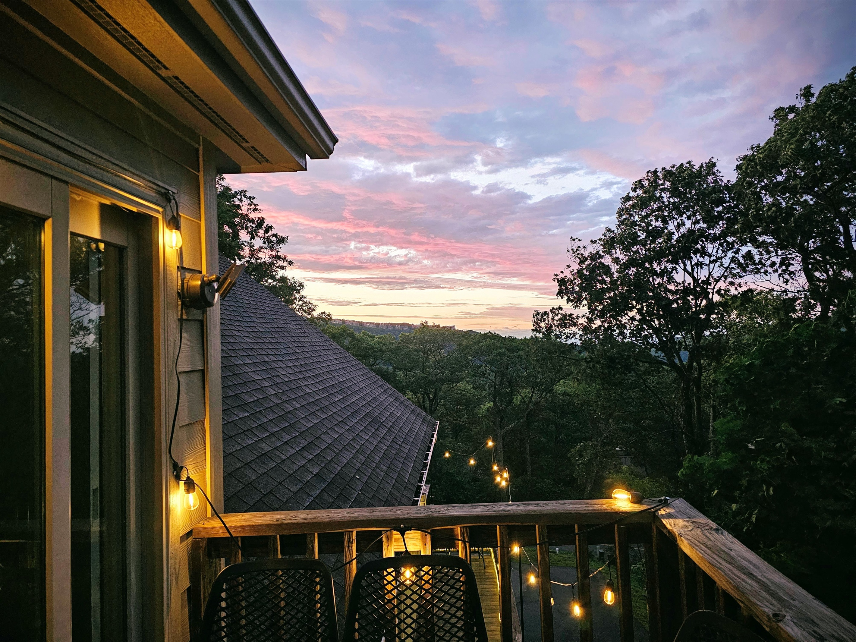 Sunset magic from the Vista Balcony—watch the sky ignite as string lights glow and the mountain quiet settles in. A favorite spot for wine or wonder