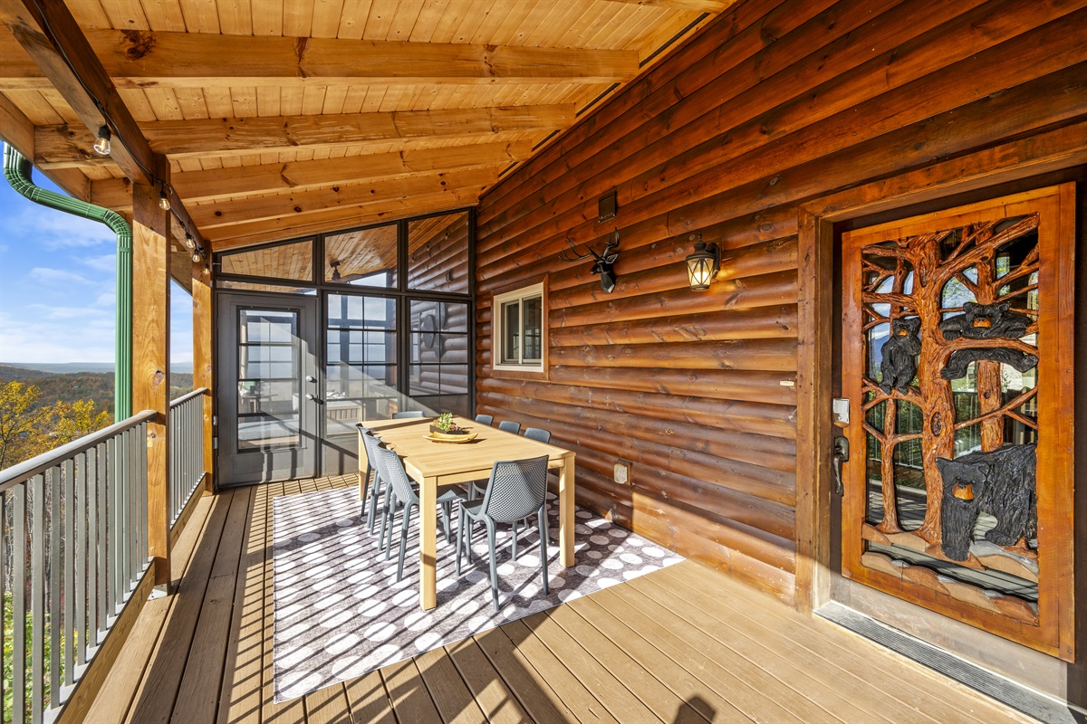 Front door of Signature Stay, by the outdoor dining table for 8, where you'll be surrounded by stunning views of the Smoky Mountains