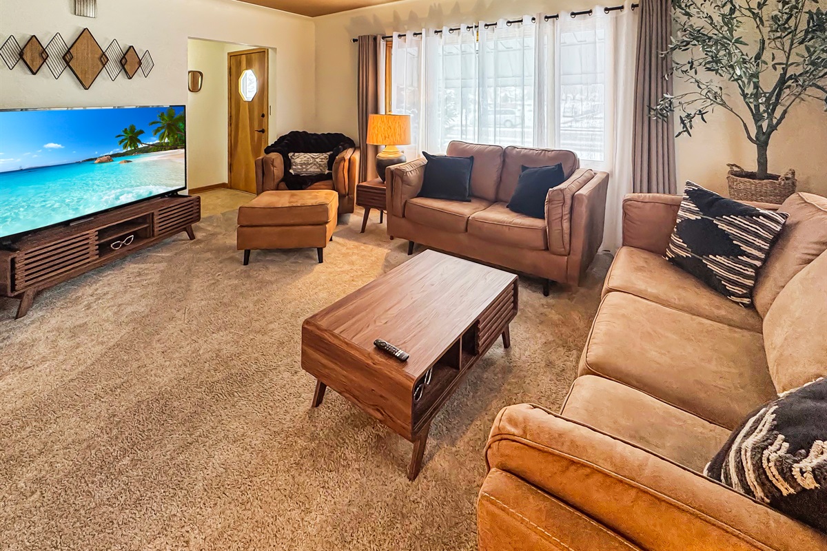 Cozy up on comfortable seating and enjoy the massive 75" screen