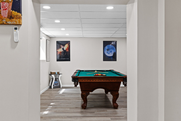 Large windows let in ample natural light keeping the entire game room bright, open, and inviting
