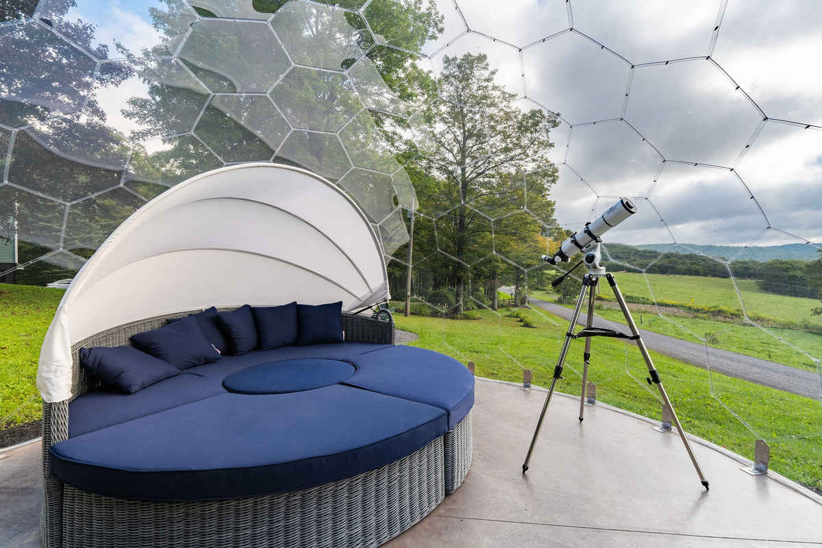 🛋 Inside the dome: a day bed that converts to seating for 8, a coffee table and a telescope. Stargaze without freezing.
