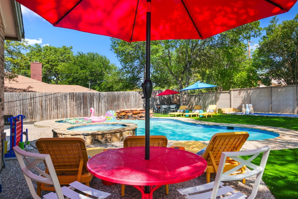 There’s multiple shaded dining areas around the pool and back yard for you. 