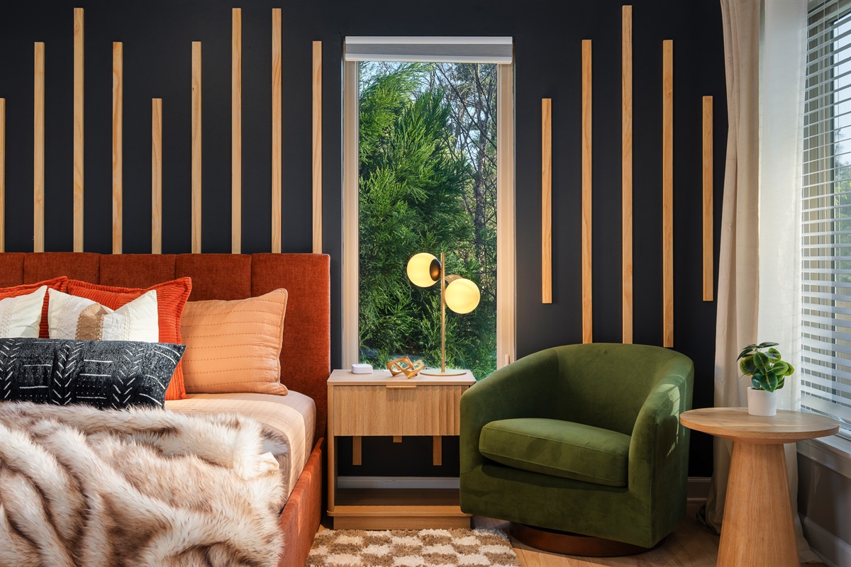 Design-forward bedroom with layered textures and natural light - comfortable space to recharge