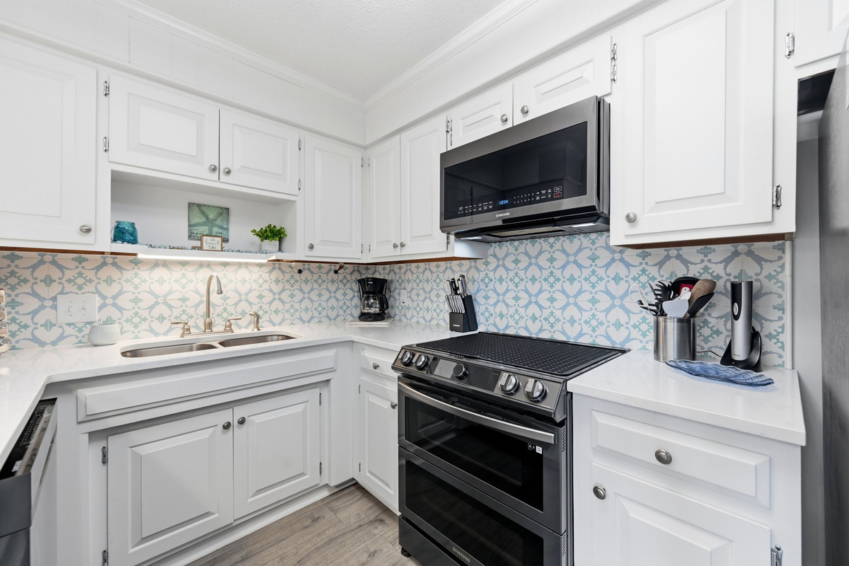 This bright white kitchen blends coastal charm with modern elegance.