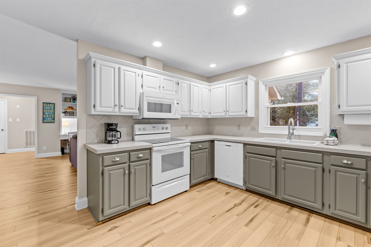 Fully stocked kitchen with all utensils, silverware, and more.