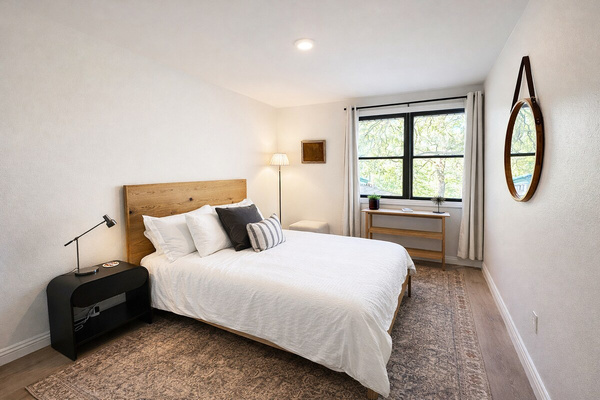 A crisp, comfortable bedroom offering restful accommodations for guests.