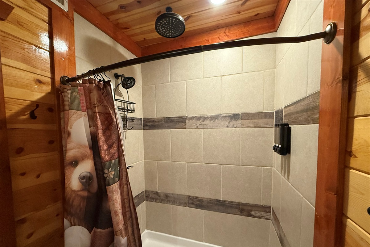 Even the bunkroom ensuite bathroom features a luxurious dual rainfall shower.