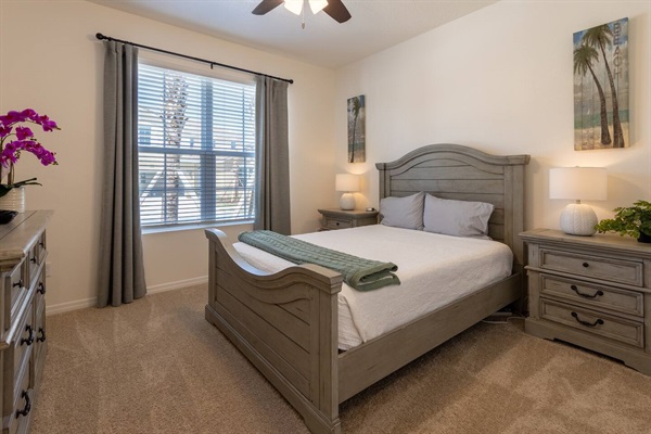 Downstairs Tropical Bedroom with Queen Bed and automatic incline feature. Comes with 70 inch TV and private bathroom and shower. Luggage rack & laundry basket in closet.