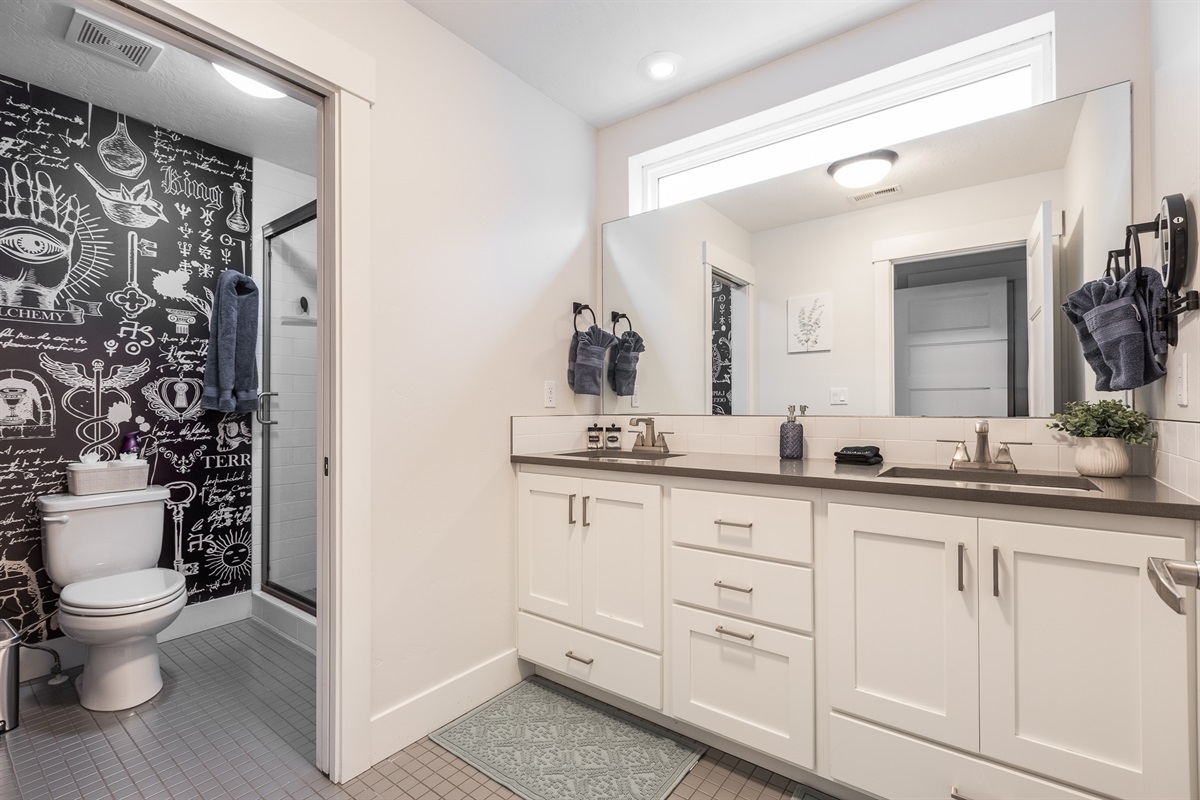 Front Master Bathroom with dual sinks, a private toilet, and stand-up shower