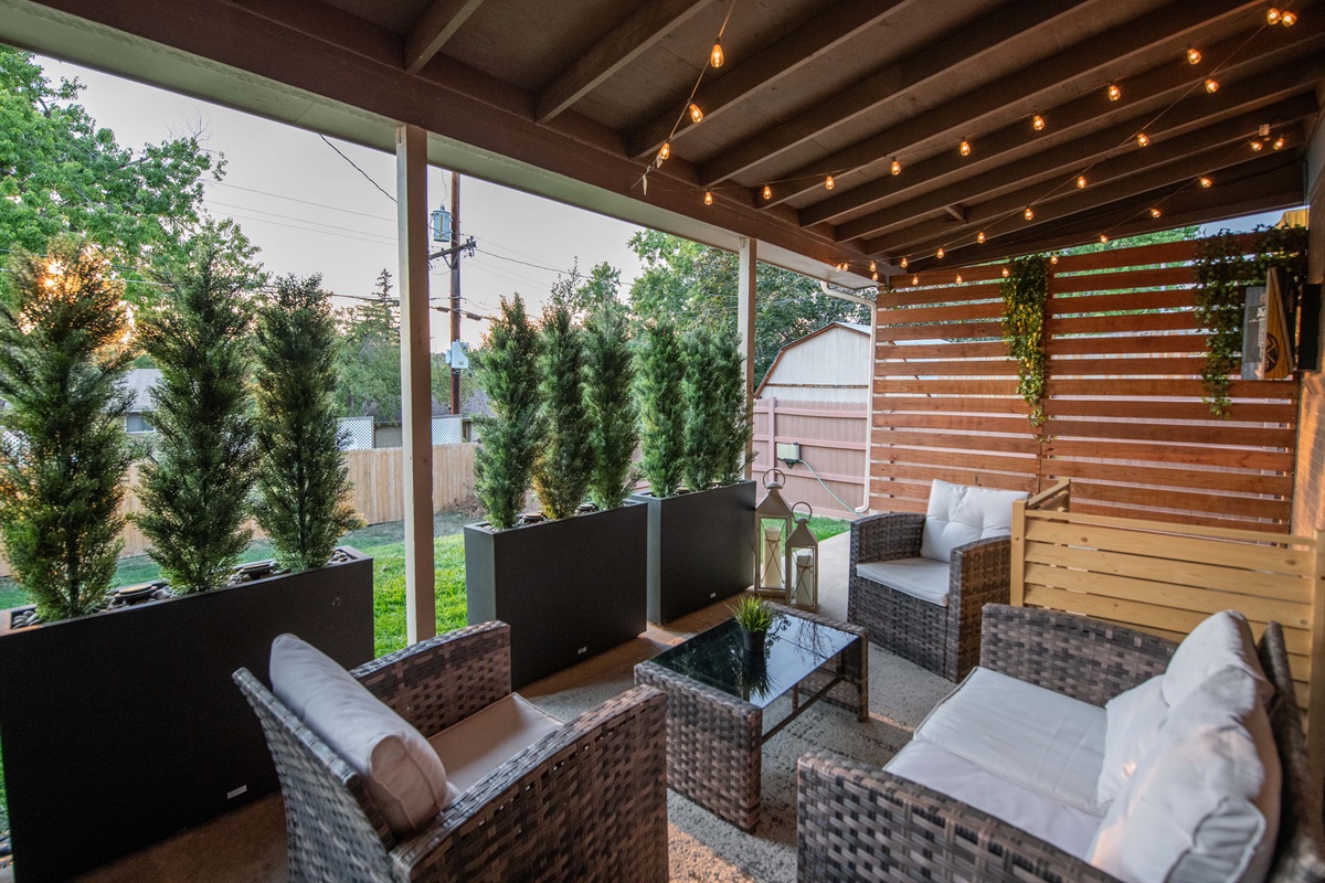 Relax on the covered patio with plush outdoor furniture