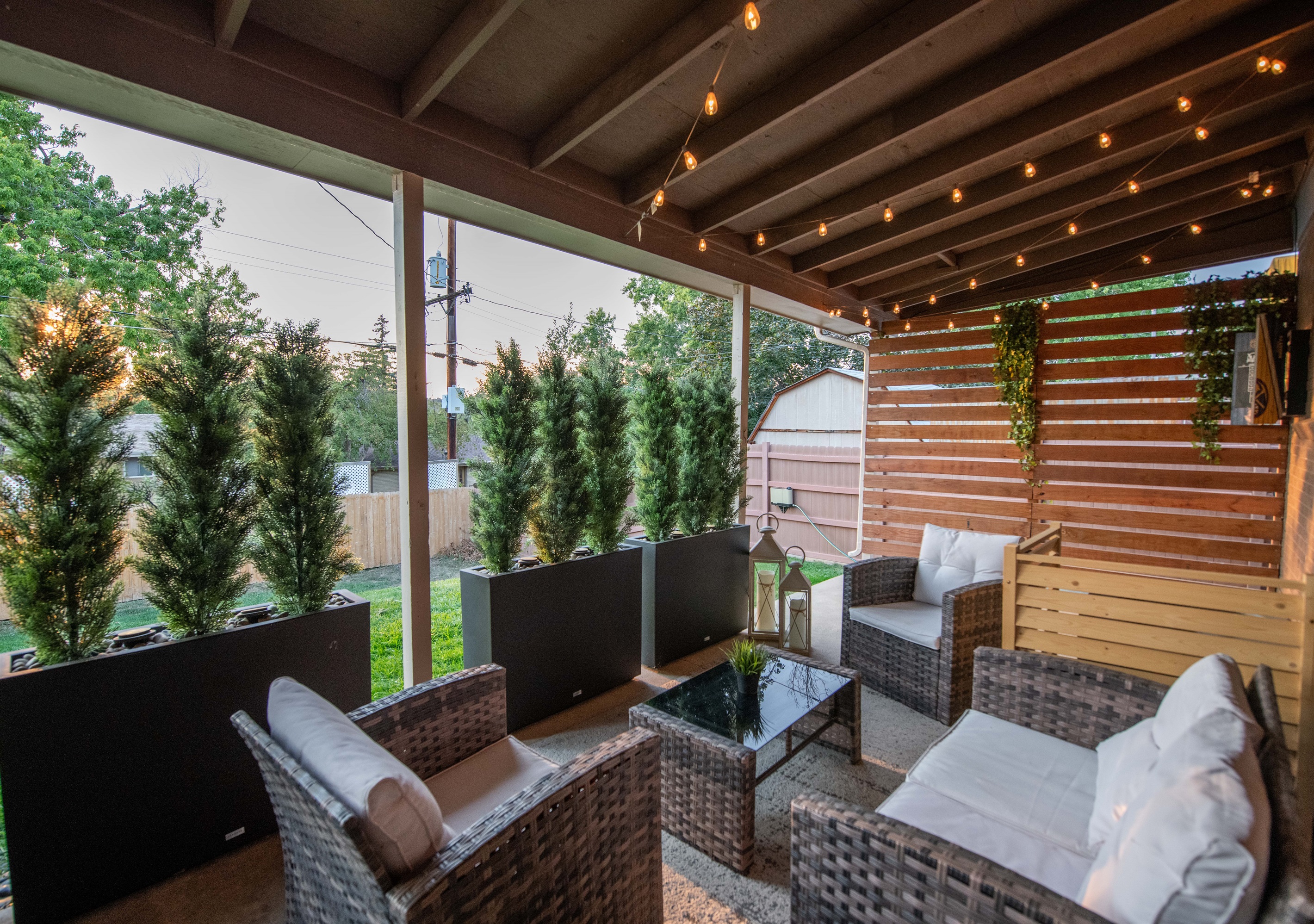 Relax on the covered patio with plush outdoor furniture