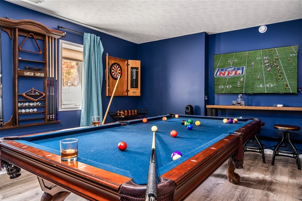 Your game-night headquarters—pool, darts, big-screen sports, and plenty of room for friendly competition