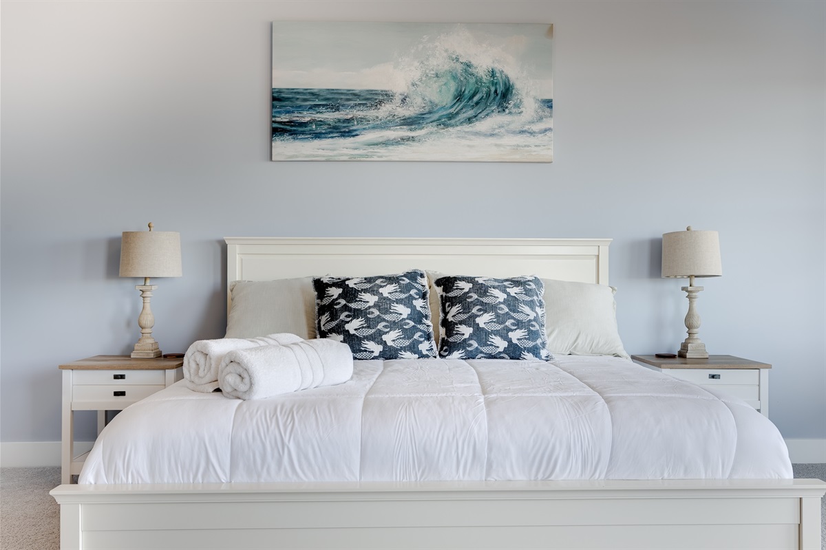 Master bedroom retreat with a plush bed, soft linens, and calm coastal d&eacute;cor designed for restful nights