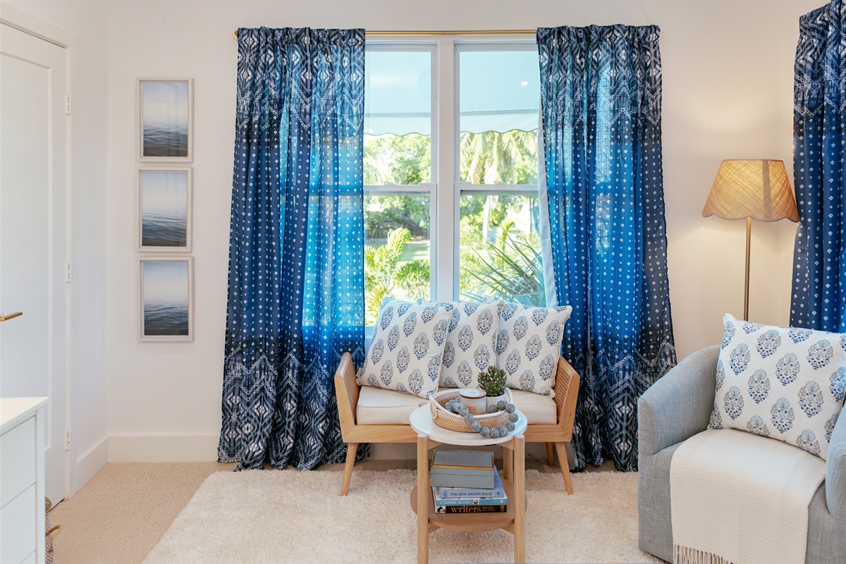 The second bedroom is next to the main bedroom, continuing the them of high design with a bonus additional seating area with plenty of space.