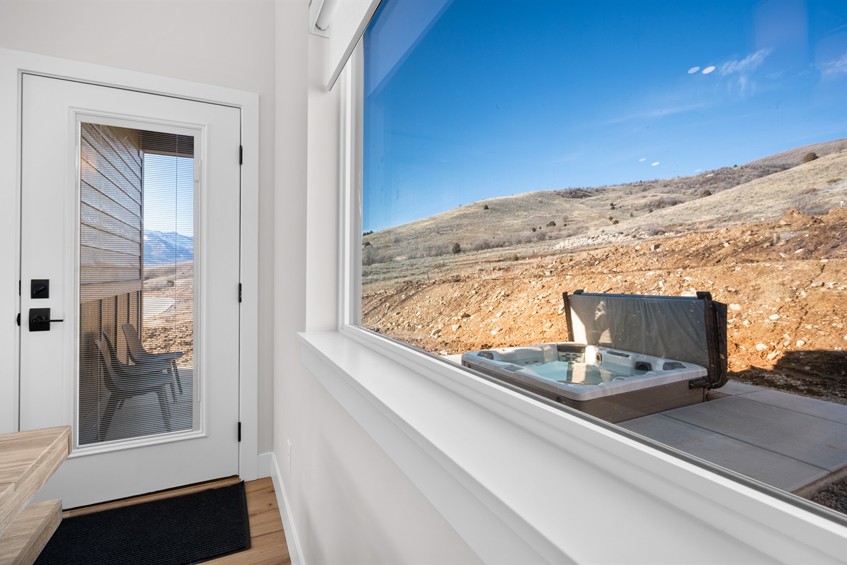 Soak under the stars in your private hot tub, just steps from the primary suite, with wide-open mountain views.