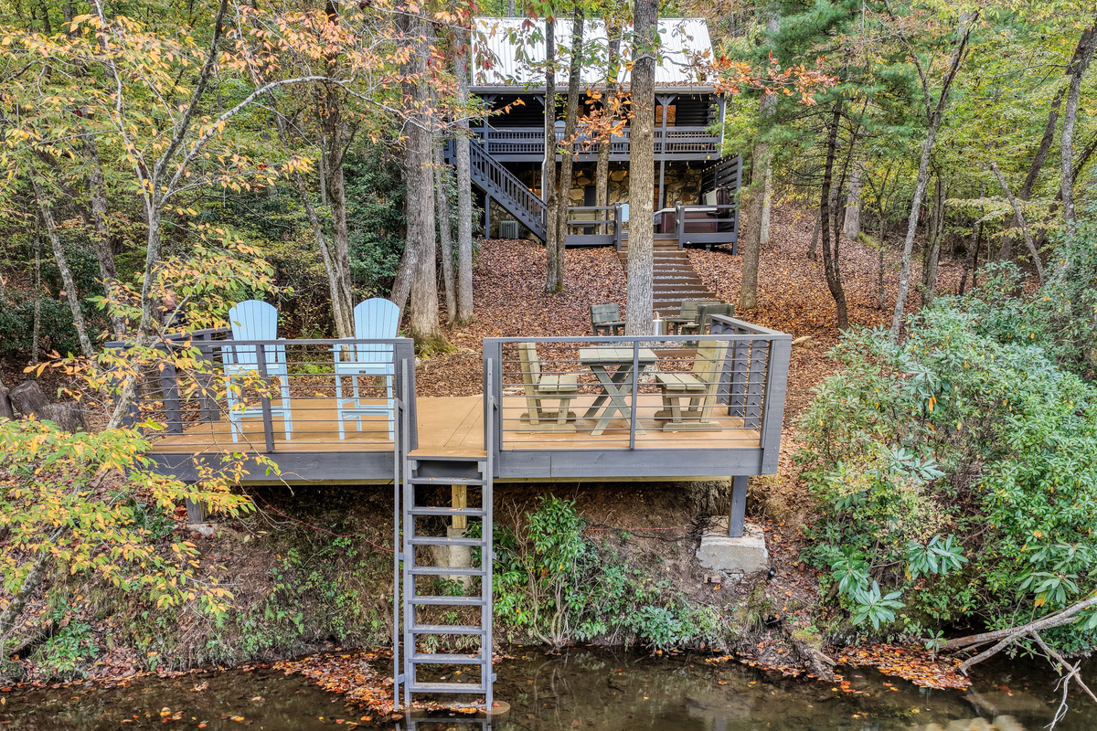 Lower deck seating among the trees.